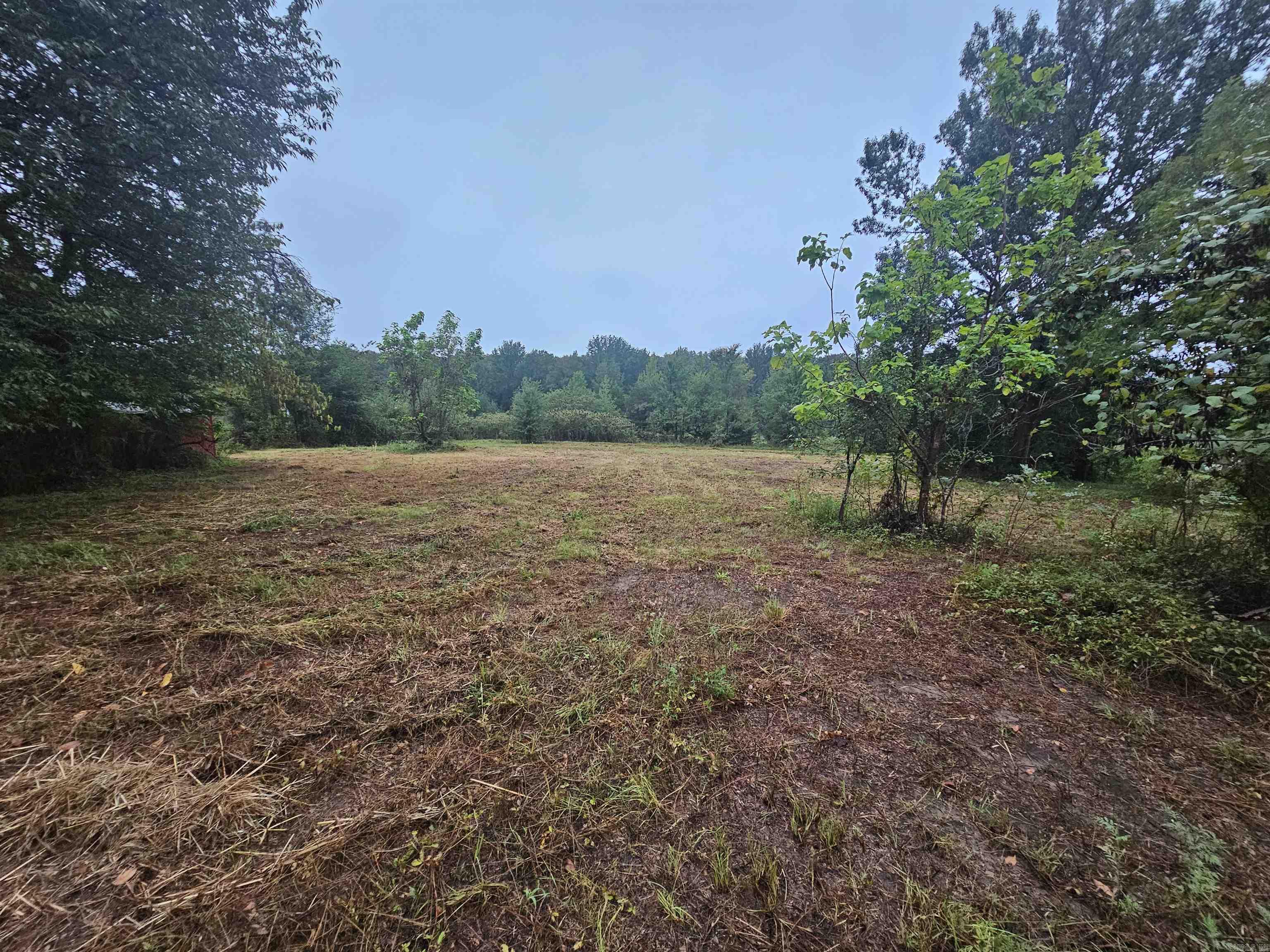 Beautiful Flat 1.85 acres outside of city limits. Great location to build a home and shop!! No restrictions. No Sellers Disclosure will be provided. Owner has not occupied property. Entire property is fenced.