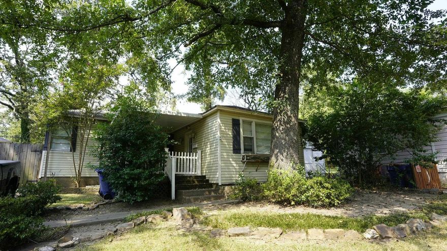 This traditional post WW2 bungalow is tucked away in Cammack Village across the street from the University of Arkansas property. It is within walking distance to all the Heights shops, restaurants and the grocery store. The house needs some tic but features two bedrooms, two baths, Hardwood floors, central air and a fully fenced backyard with a storage building.