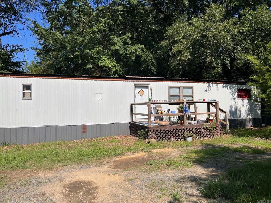 Located on a .42 acre lot find these two 2 bedroom 1 bath SW mobile homes. Both feature front decks, sit on a quiet street with plenty of natural landscaping and are rented. Great ROI! See agent remarks!