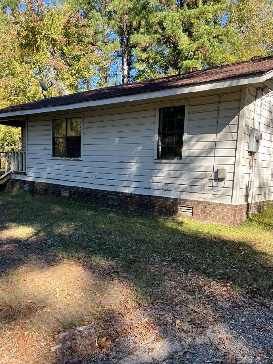 Endless potential in this older home. It is at the end of a quiet road for privacy and serenity. It is located on a half acre lot. Ideal for a first time buyer. Needs some tender loving care. Schedule your showing today and start imagining the possibilities. Property is sold as is.