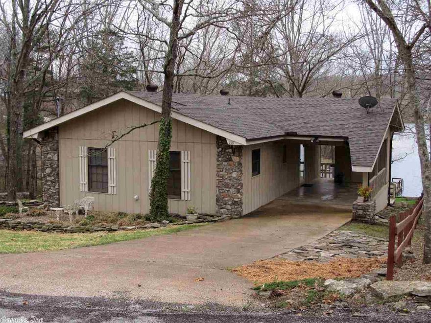 Lake Sequoyah Dandy! This move in ready lake home is just right for easy year round living or vacation fun. Two bedrooms, 1-1/2 baths, efficiency kitchen, step down living room and a dining area are just a few features. There is a wood stove, covered deck, landscaped yard, boat dock and an extra lot next door to add to the privacy. All this at a ready to sell price of $106,500.00.