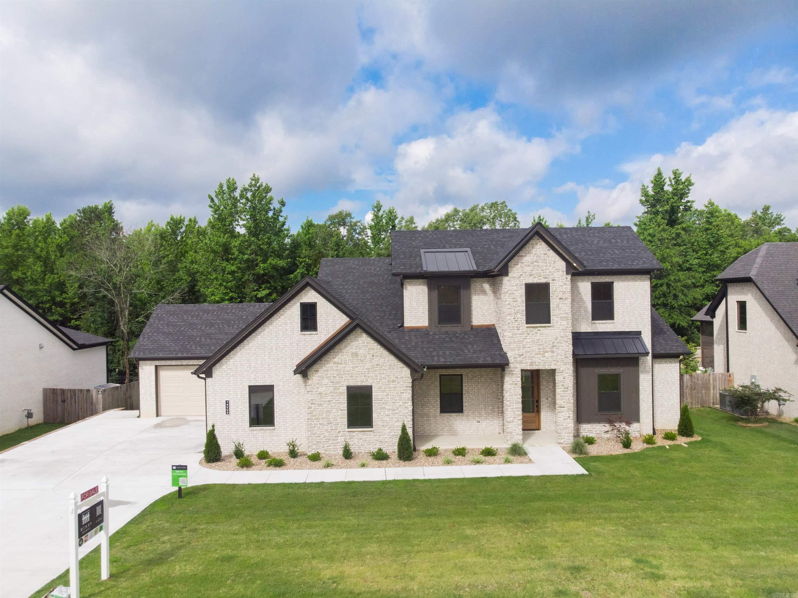 Move in Ready! Welcome to 14509 Stonebrook Lane! Nestled in the trees of the Stonebrook gated community in Maumelle, this stunning 4-bedroom, 3.5-bathroom home offers 3,065 sq. ft. of thoughtfully designed living space. With a 3-car garage, a spacious covered back porch, and premium finishes throughout, this home is a perfect blend of elegance and comfort. The main floor features an open-concept layout, complete with a dedicated office space for work or study. Upstairs, a versatile flex space awaits, ideal for a media room, play area, or home gym. The large covered back porch provides the perfect spot to unwind and enjoy the serene surroundings Stonebrook is known for. This home delivers luxury living in a vibrant community filled with amenities. Schedule a self guided tour on our website or call our office.