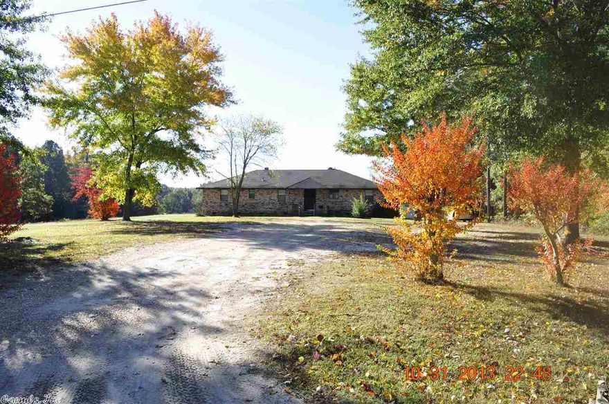 Private country home with 5 acres perfect for horses and livestock. All brick 3 bedroom/2 bath home with garage, barn, tack room and outside storage. Beautiful brick fireplace in living room. Clean well kept property! Bryant Schools!! This is an approved Short Sale through Chase Mortgage. Send me an offer today!!