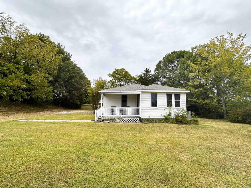 2447 Heritage Park Road is a must-see property! Sitting on .98-acre lot, the home is 1,028 sq. ft. with 2 bedrooms/ 1 bath, the home includes a reading nook in the living room, a small, enclosed entry way, and eat-in kitchen area. Front and back covered porch area and attached covered carport. The property includes all kitchen appliances, washer, dryer and outdoor storage/shop area with beautiful shade trees. Give me a call today to check out this property!   *Pipes froze and busted this past winter. Plumbing has been repaired, but still water damage to bathroom floor and minor damage to front bedroom that need repaired. *