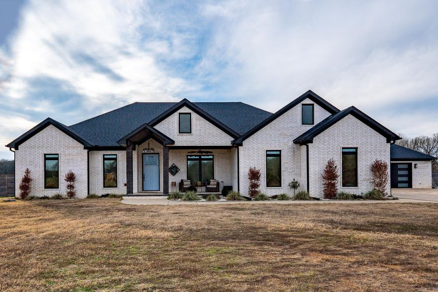 Come check out this Gorgeous 3 bed 2.5 bath home built in 2022 sitting on 10 acres!  This home comes with two stocked ponds, Salt water pool, hot tub, outdoor wet bar, outdoor dog run, dog washing station, large fenced in back yard and SO much more. Custom showers, huge pantry, Granite countertops, safe room, surround sound, detached heated and cooled garage with half bath and the list goes on.  Schedule your showing today!  Agents please see remarks.