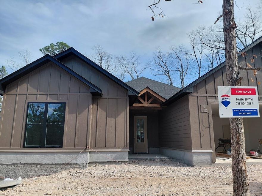 What a view on the 10th fairway of Hot Springs Village's desirable Ponce course. Deaton's popular Peppercorn plan was made for todays modern lifestyle. Gourmet Kitchen with large center island, gas cooktop with custom range hood, built in oven and microwave and oversized walk-in pantry. All with views of the living and dining space, two back covered porches and an outdoor fireplace will make you never want to leave! As always 9 and 10 ft. ceilings, custom maple cabinetry in the kitchen and all bathrooms, luxury vinyl floors throughout. Both full baths have custom tile showers and the primary includes a freestanding tub. The Primary suite closet connects to the utility room which connects to the mud room which makes this home not only beautiful but super functional. The oversized garage will give you extra storage space and the  flat driveway will allow you to enjoy your home for years to come . Expected completion in April!