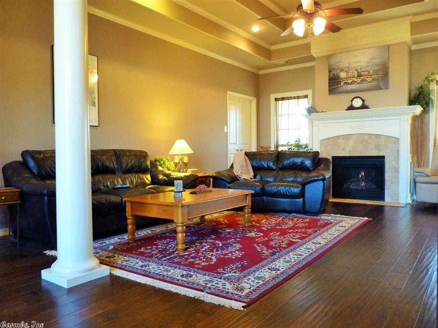 Beautiful like new home located in the heart of Bryant. Home features tray ceilings in living, formal dining and master bedroom and crown moulding through out. Has granite counter tops in kitchen and wood flooring in entry and living space. Home sits on great sized lot with large backyard. No details spared with this one.