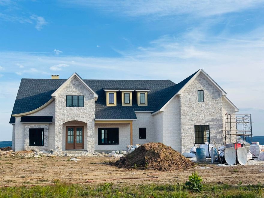 Open floor plan with large vaulted great room, kitchen, and primary bed/bath. Transitional rooms all featuring a breathtaking view of Lake Maumelle, Pinnacle Mountain, Chenal Mountain, and the foothills of the Ouachita National Forest.