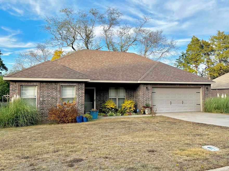 Warmth, Style, and Welcoming are a few descriptions of this Ridgewood S/D home!   This 3 bdrm 2 bth beauty is close to Harps grocery store and not far from Westside Elementary School.  Open living, dining & kitchen floor plan also split floor plan with the master apart from the two spare bedrooms.  Wood and tile floors throughout with granite in kitchen and bathrooms.  Master bath has jacuzzi tub with shower & walk in closet seller installed a 50 gal water heater not long ago. Double garage offers extra storage and the deck in the backyard overlooks a firepit for those cool nights to roast those hot dogs or marshmallows!  The backyard is full of raised beds where the seller has raised vegetables and lots of herbs they can convey with the property.  This home would make a wonderful starter home or for those empty nesters wanting to simplify!  Call for your tour of this beauty today!