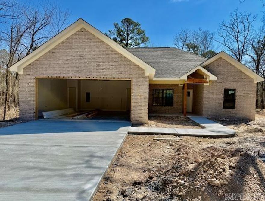 Centrally located in a private setting sits this all brick home built by Jackson Custom Homes on a flat lot. Scheduled to be complete end of April! All brick home located in the middle of the Village giving you easy access to area amenities. Tongue and groove wood ceilings front and back porch. Open the door and walk in to the open floor plan including kitchen with an island. Custom shaker cabinets with soft close drawers and doors. Quartz counters throughout. Windows bring the outside in to the living/dining area with fireplace. Primary bath has a zero entry walk in tile shower, two sink vanity and walk in closet. Energy efficient with modern finishes. Covered patio for nature watching. Builder one year warranty. Taxes lot only.  Agent Remarks.