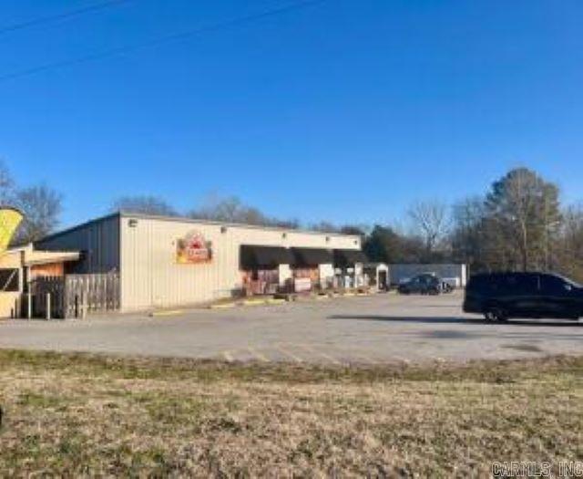 PRIMO, PRIMO, PRIMOOOO LOCATION! TALK ABOUT A BUSY INTERSECTION: THIS IS IT! Level corner lot of Highway 14 and Highway 167 (approximately 1.70 acres) with a 4532 Sq. Ft. Commercial Building currently divided in half by a very successful, long term restaurant and the other half as a very successful, long term tobacco/convenience store with other retail. Very easily, this unit could be a 3 unit building again as it once was. 3 phase power, natural gas, city sewer, city water, fiber optic options, is all you can ask for! Very easy access from both highways, superior visibility from any direction, and a low maintenance building & exterior complete the package! This has been the solid foundation for COMPLETE SUCCESS & it is a once-in-a-lifetime opportunity for someone else! Don't hesitate!