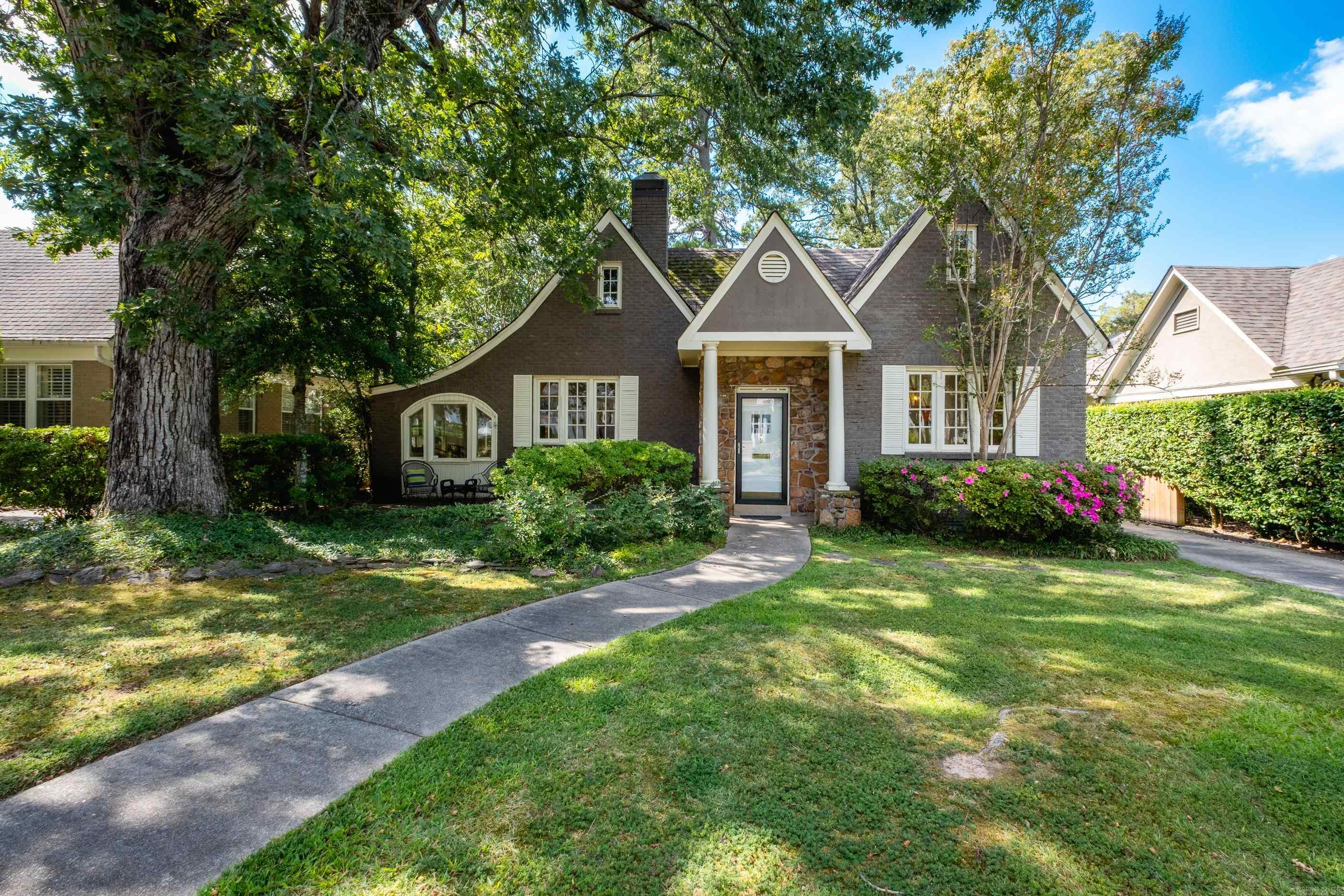 Charming Heights Bungalow - modern updates with classic charm. Cozy front porch surrounded by lush landscaping. Spacious living area features hardwoods and accesses versatile sunroom/office/hobby/reading room. Natural light floods every room, large windows. Detached studio apartment/guest house 632 square feet not included in 1748 sq. ft. Private back driveway with electric gate complete with 2 car cement parking pads. Guest house is complete with full kitchen, den, full bath and bedroom. Excellent income producing private rental space. Beautiful street in the heart of the Heights! See attached documents for list of updates and remodel done on main house and guest house.