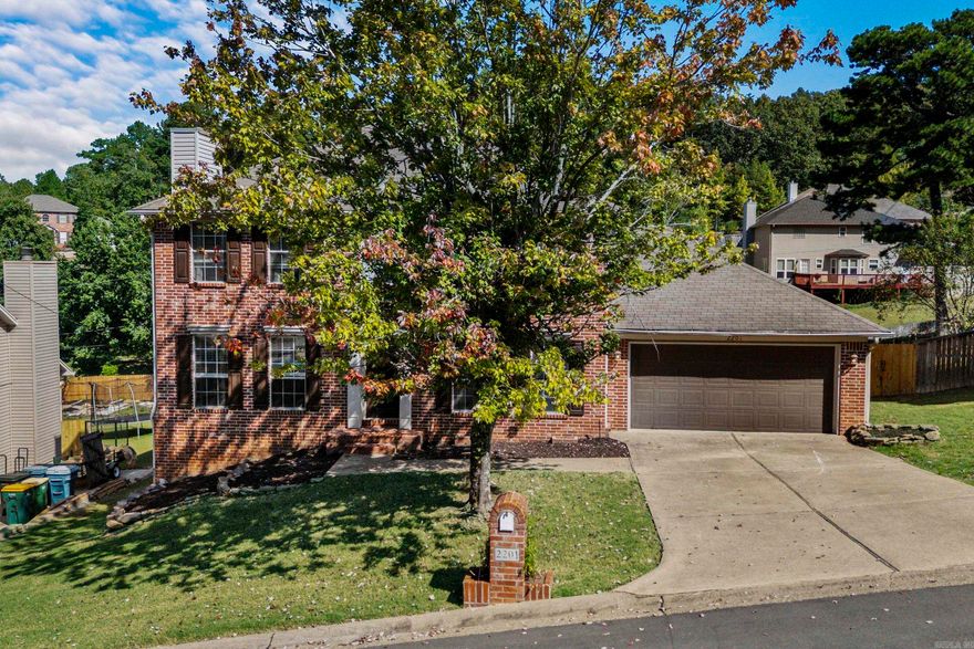Welcome to this charming and spacious 3-bedroom, 2.5-bathroom home located in the heart of Little Rock! Sitting within a quiet neighborhood, This classic two-story traditional home offers 2,092 square feet of thoughtfully designed living space, perfect for comfortable family living. The brick front exterior, accented with timeless shutters, provides excellent curb appeal. The interior layout includes a formal dining room, spacious eat in kitchen, laundry room, and a large formal living room with a stunning brick fire place. Going upstairs, the massive primary suite features two walk in closets along with both a bathtub and shower. You also won't want to miss out on the beautiful backyard and deck, perfect for enjoying afternoons with kids, friends, or pets! This home also features a large 2 car garage with a shop/storage area.