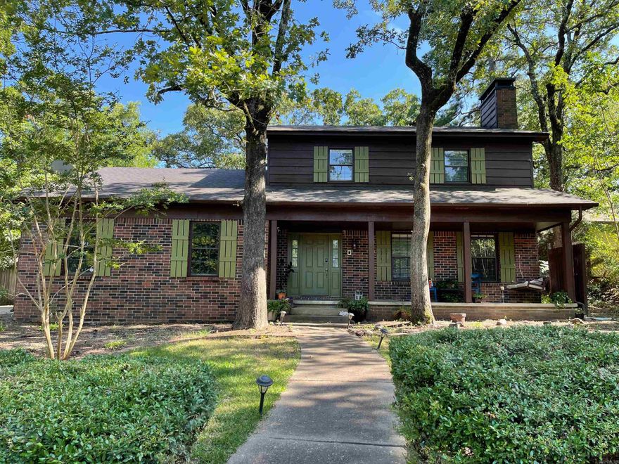 Beautifully updated home in Marlowe Manor, located directly behind Pulaski Academy. Built in 1978 and tucked at the end of a quiet dead-end street, this 3-bedroom, 2.5-bath home offers exceptional privacy and a park-like backyard while being minutes from shopping, dining, and the interstate.   The updated kitchen features quartz countertops (including a 9" deep quartz sink), an island built for conversation, glass tile backsplash in a herringbone pattern, Bespoke refrigerator that conveys, and designer light fixtures. Quartz countertops continue in two of the bathrooms and the spacious laundry room. Full bathrooms feature cast iron tubs with tiled surrounds, and dual vanity in the primary. New carpet in all bedrooms (December 2025), and two of the bedrooms boast a walk-in closet.    Enjoy outdoor living on the covered front porch or the large backyard patio—perfect for entertaining. The oversized, side-entry two-car garage offers a large storage closet and cabinets that stay.   Other features include: a wood-burning fireplace with insert, large great room for hosting, bay-window with bench seat, laundry chute, trash compactor, access to park and pool, and more.