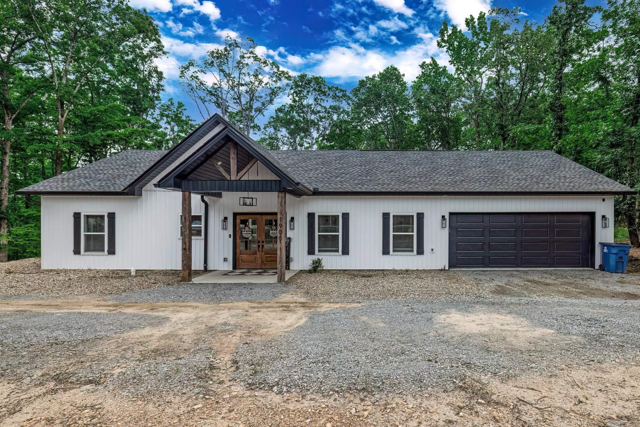Discover modern comfort and style in this stunning three-bedroom, two-bath home built in 2023, ideally located just outside of Malvern, Arkansas. Designed with an open-concept layout, the spacious living and kitchen areas offer the perfect setting for both everyday living and entertaining. Step outside to a beautifully fenced backyard that’s truly an outdoor retreat, featuring a cozy fireplace, inviting seating area, and a separate fenced dog run with its own private entrance into the home and a convenient pet wash area. Inside, you’ll find a generous laundry room and an oversized primary closet that adds to the home’s thoughtful design. The primary suite is a peaceful escape, complete with a luxurious walk-in shower. With unique details and custom touches throughout, this home effortlessly blends function and charm in every space.