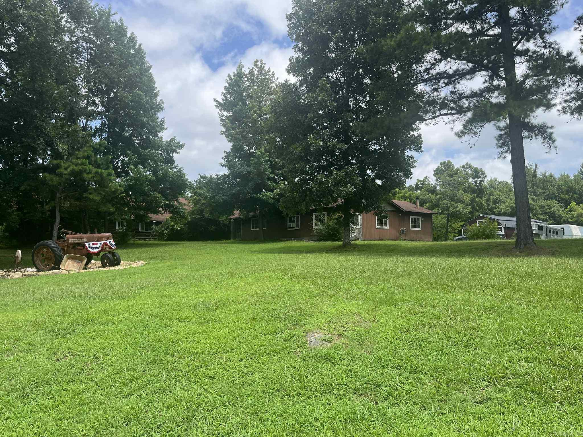 40 incredible acres with a SPACIOUS fixer upper! Beautiful year-round creek, a large stocked pond, and meandering trails make this property incredibly beautiful and unique. Brimming with history, the log portion of the home was originally built in the 1800’s but has additions from the 1950’s. Now mostly stripped down to the studs, this home is begging for a handy buyer to bring it back to life! There is a new metal barn on site, as well as an in-ground pool which could be lovely once renovated! There is a new concrete spillway on the pond that was completed last year. Wanting to roll up your sleeves and create your own country oasis, this could be it! New building materials on site can convey with sale.