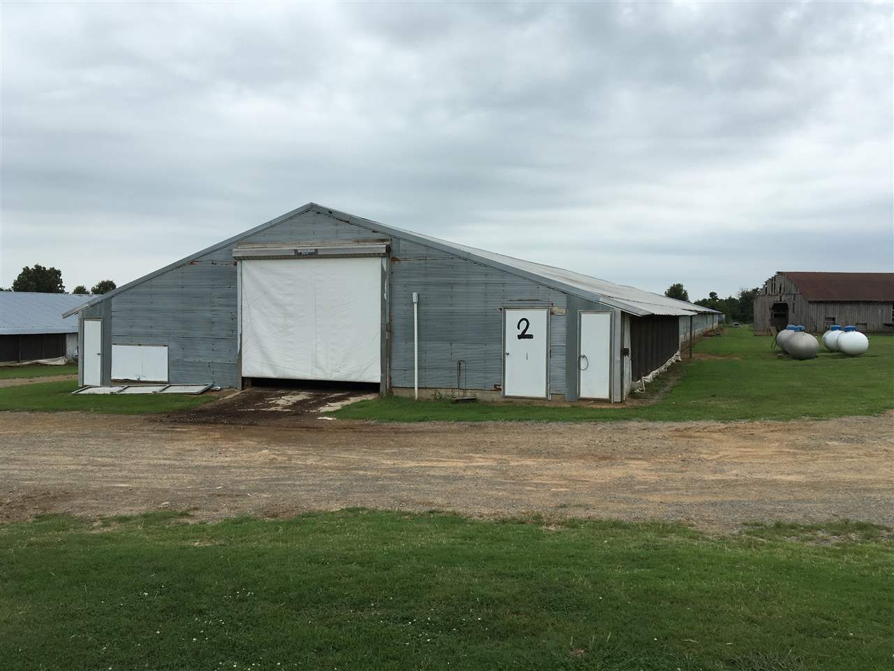 This 22 acre property has 5 OMP Broiler Poultry Houses, Enclosed shop, Machine shed, Large storm cellar, and a 3 bedroom 2 bath mobile home with a nice porch!  There is also a trailer for a hired hand to live on property.  Very clean and well maintained piece of property.  Poultry houses had birds in them just 3 weeks ago.  Houses place in top 5 but there will be some upgrades.  This all sits on highway 167 in Velvet ridge just a few miles north of Bald Knob.  If your looking for a farm here it is.