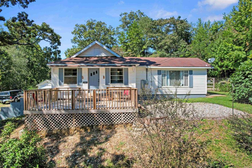 This remodeled home blends historic character with today’s comforts, just minutes from downtown Hot Springs and major highways.  Inside you’ll find 2 bedrooms, 2 baths, a flexible office (or extra bedroom/game room), a cozy kitchen/dining area, and a bright den with large windows overlooking the yard.  The fenced backyard features a new deck shaded by majestic oaks, creating the perfect spot for kids and pets to play. The property also offers pear, peach, plum, and fig trees, giving you fresh fruit right at home. A detached garage, storage building, and drive-through carport add convenience.  Enjoy peaceful country living with easy access to city amenities!