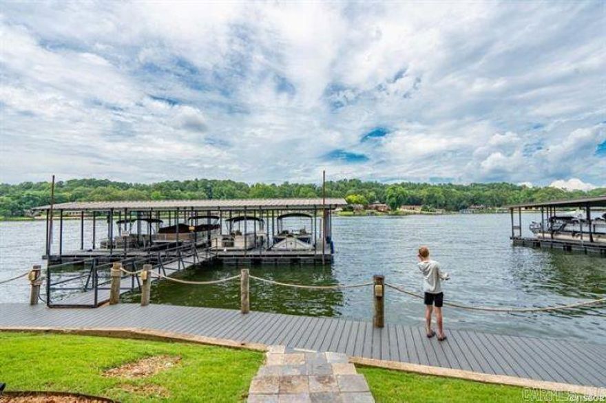 Spacious 3-Bedroom, 3-Bath Condo on Lake Hamilton Enjoy peaceful lakeside living in this beautifully maintained waterfront condo, perfectly positioned directly on Lake Hamilton. This spacious open-concept unit features 3 bedrooms and 3 full bathrooms, with two bedrooms on the main walk-in level and a third private suite downstairs—ideal for guests or extended family. Features include 9-footceilings, stunning water views, and access to a community pool and clubhouse. The condo is located in a secure, gated complex with a serene atmosphere and no short-term rentals allowed, ensuring a quieter, more residential environment. Centrally located, you're just minutes from shopping, medical facilities, dining, Oaklawn Casino, and downtown Hot Springs. Whether you're seeking a full-time residence or a low-maintenance second home, this property offers comfort, convenience, and unbeatable lakefront living.