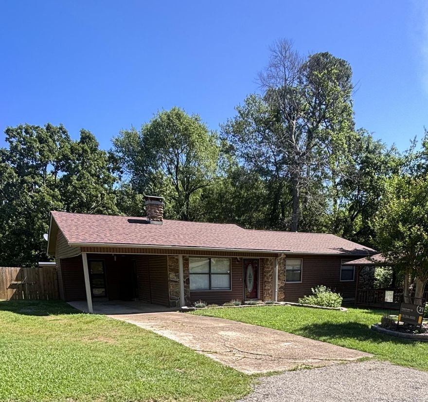 Classic charm! Lovely well-maintained 3 bedroom, 2 bath home, sits on .44 acres inside city limits. The home features new quartz counter-tops in the kitchen and coffee bar area, stainless steel appliances, new paint throughout the house, new heat and air system, new vinyl siding, new roof in 2025, large den and living room, has a nice cozy fireplace. Backyard features a privacy wood fence with a concrete floor shop and storage building. Large wooded lot next door with a wet weather creek provides so much privacy. Gazebo out front with porch swing to sit and enjoy the lovely landscaping of flowers and shrubs that draw beautiful butterflies. Come check out this wonderful place!