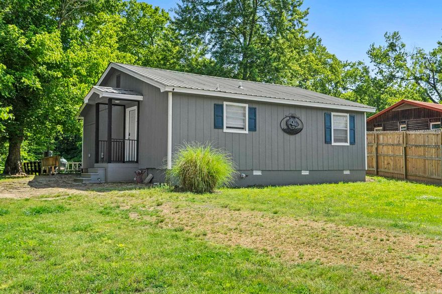 Nestled along the serene banks of the Little Red River, this beautifully remodeled 2-bedroom, 2-bath cabin offers the perfect blend of comfort, charm, and waterfront living. Completely renovated just two years ago, the home was expanded to add additional square footage while maintaining its cozy cottage appeal.Large windows span the entire back of the home, filling the living spaces with natural light and offering breathtaking river views. Step outside onto the spacious deck, where a private walkway leads directly to your personally owned boat dock — ideal for fishing, relaxing, or enjoying life on the water. Known for world-class trout fishing, the Little Red River provides an outdoor experience second to none. After a day on the river, unwind in the brand-new hot tub installed in April 2026, where you can soak in the peaceful surroundings and watch nature unfold from your own private spa retreat. Whether you're looking for a full-time residence or a vacation getaway property, this riverfront gem delivers tranquility, recreation, and unforgettable views in every season.