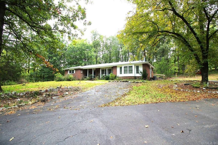 Charming Home on 4.89 Acres Near Lake Ouachita This three-bedroom, one-and-a-half-bath home sits on 4.89 acres conveniently located on the highway, just about 4 miles from beautiful Lake Ouachita. The property includes a large detached garage/storage building and an RV shed, offering plenty of space for vehicles, boats, and outdoor equipment. Priced well below a recent appraisal to reflect needed repairs, this property is an excellent opportunity for anyone looking to invest in a home with great potential and an ideal location close to the lake. New roof in August 2025, H/A about 8 years old, newer tile shower, vinyl windows.