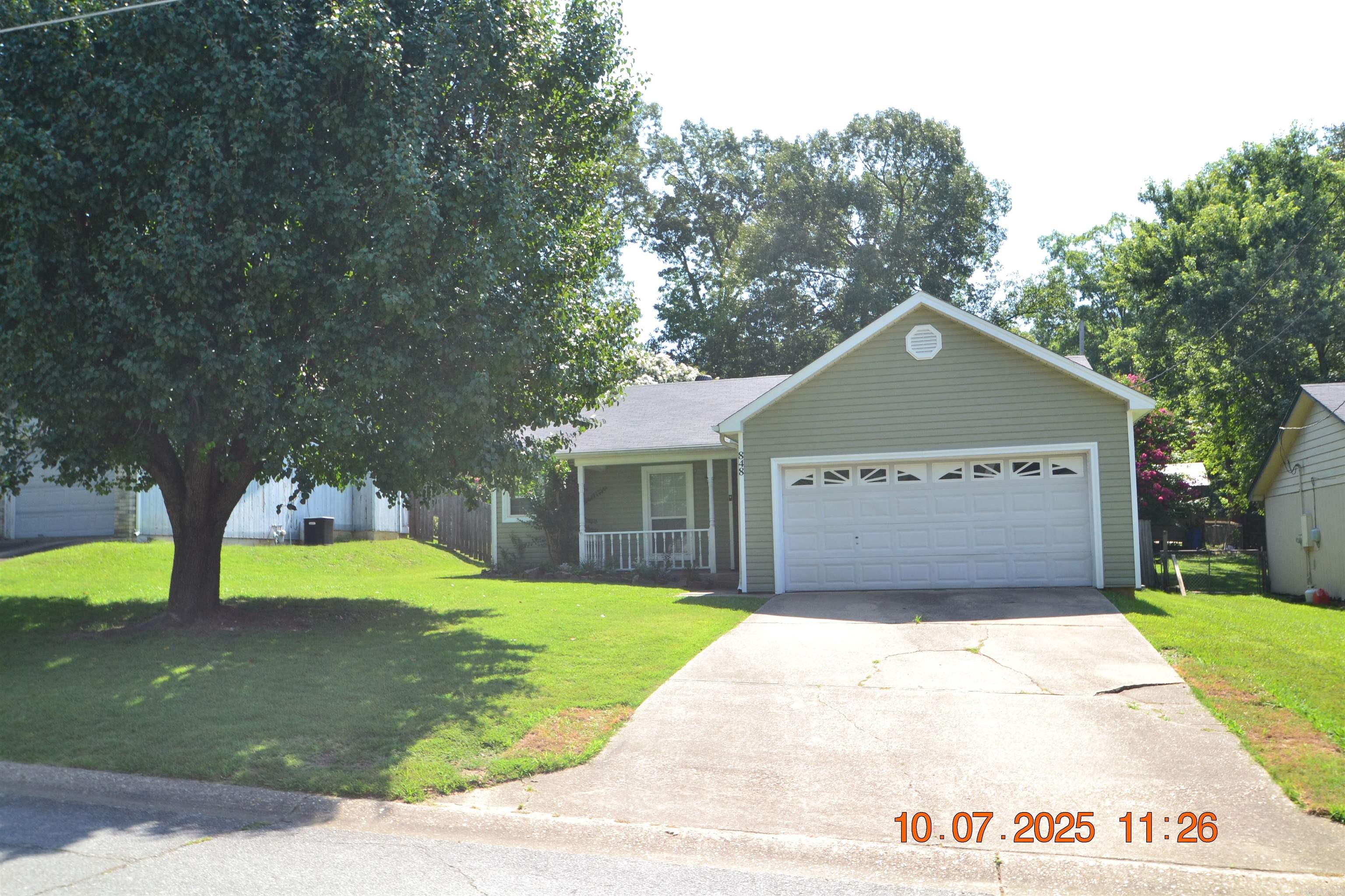 Super cute home with adorable street appeal! Completely refreshed with new paint, flooring, deck repainted in 2025. New A/C, ductwork & heater in 2019. New siding in 2018. The greatroom has a vaulted ceiling with fan & French doors leading to the deck. The primary bedroom is separate from two additional bedrooms. It has a fan & adjoining bath with a shower/tub combo & walk in closet. Tile floors in the kitchen accent the painted cabinets. Nice appliances include a gas range, vent hood, dishwasher, disposal & there is a pantry. The backyard is a paradise with crepe myrtle trees overlooking the tiered deck and fire pit. You'll spend many days enjoying this private, fenced yard. Hurry and come see this one!