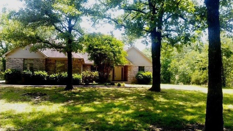 Quick and convenient for all commuters. This home is less than 3 minutes from I40 and is nestled on 4 acres of tree covered land.  The  family room has vaulted ceilings, hardwood floors, and a corner, wood burning fireplace. The kitchen has plenty of counter space and a large breakfast room.  A split floor plan offers a private master suite with tray ceilings and a spacious master bath. Side load garage with new garage door.