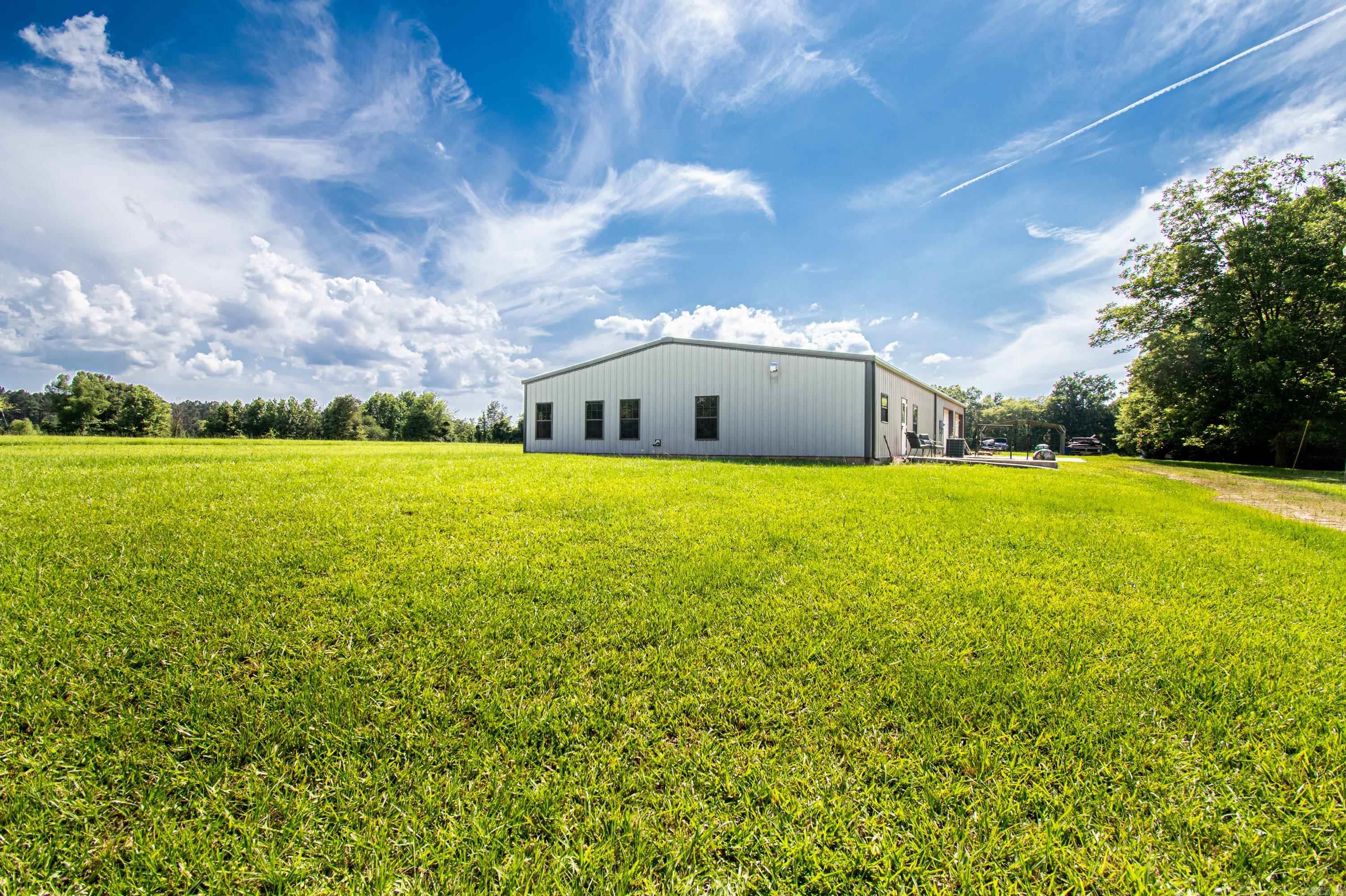 This shop house is truly one of a kind, and still has the ability to add your final touches to it. It’s approximately 75% completed on the house side of the structure. It is basically cut in half with one side being a house, and the other side being a shop with 3 large bay doors. It’s all on 6.75 acres of pasture land in Rye. The home lacks finishing touches like the cabinets, hardware, trim, bathroom finishes, etc. Come make this home yours.