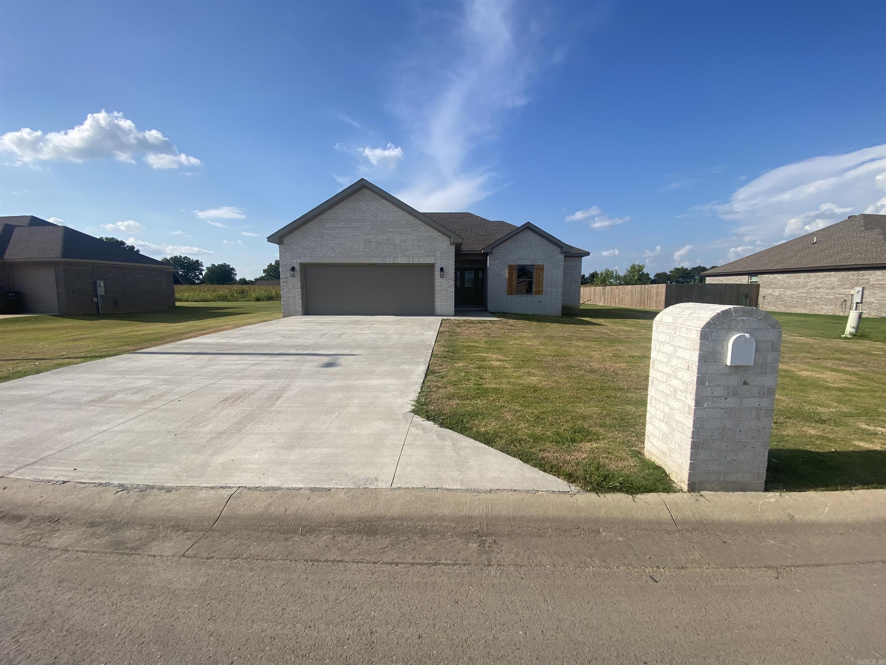 This NEW construction is a must see at well under $250,000! It's complete with a fireplace, covered back patio, split bedroom plan and even a matching mailbox. Neutral paint and LVT flooring throughout. Book your tour today!