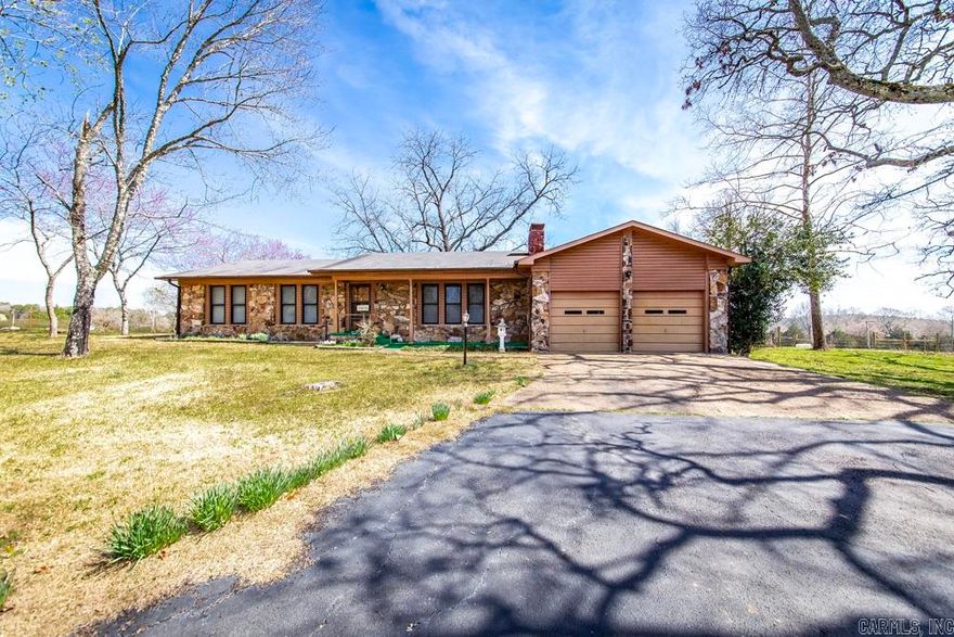 A spacious rock home setting on 1.02 acres in the country with a pastoral/woods view.  The home has a front and rear porch.  Basement (safe room) is 240 sq. ft.  Attached 2-car garage.   Detached garage with electricity on slab foundation. No zoning.  Fiber internet is available.  Garden spot.  Home is located only 7 miles to Sugar Loaf Marina and park, 33 miles to Conway and 17 miles to Clinton.
