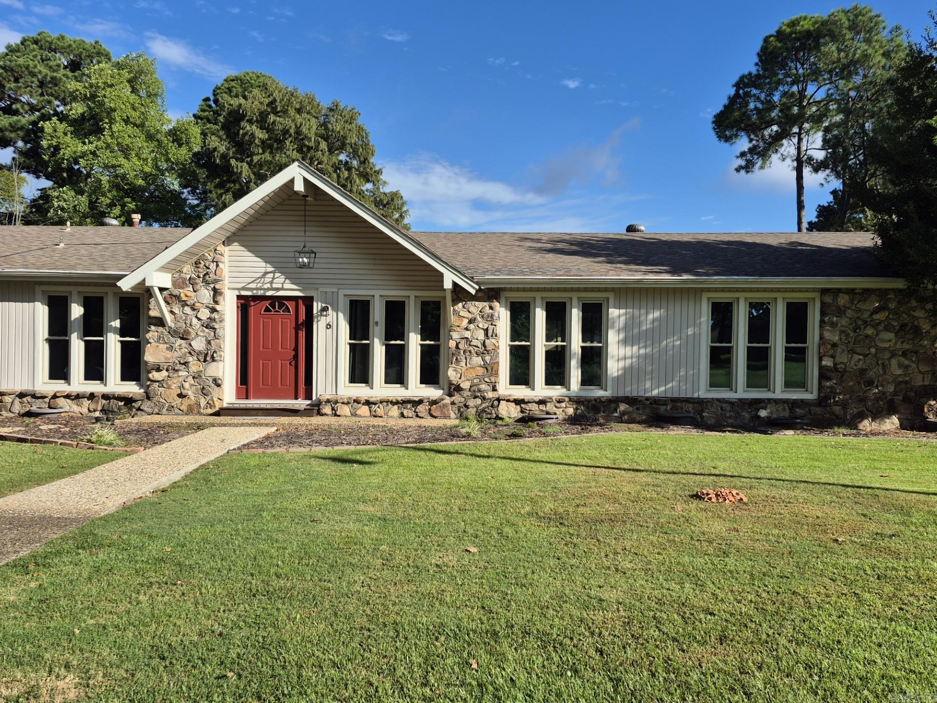 This beautiful five bedroom, 3 1/2 bath home on Indian Head Lake is move-in ready! Large great room with huge windows overlooking the lake. Walk out to the dock and fish. Next to the big laundry room is a great office space or playroom for the kids. Master suite is on one side of the home and 4 bedrooms on the opposite side, with jack-and-jill style bathrooms between. Insulated, double hung vinyl windows keep the noise out. The sunroom is heated and cooled with shades. This home checks all the boxes! Front room can be a living room or a big dining room. This could be an excellent rental property for short-term or long-term rentals.