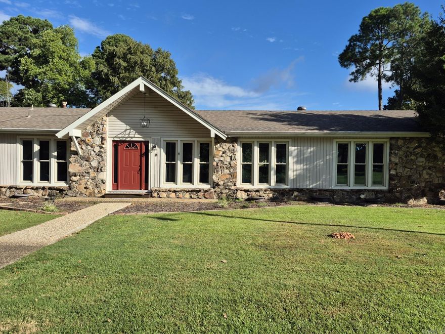 This beautiful five bedroom, 3 1/2 bath home on Indian Head Lake is move-in ready! Large great room with huge windows overlooking the lake.  Walk out to the dock and fish.  Next to the big laundry room is a great office space or playroom for the kids.  Master suite is on one side of the home and 4 bedrooms on the opposite side, with jack-and-jill style bathrooms between. Insulated, double hung vinyl windows keep the noise out.   The sunroom is heated and cooled with shades. This home checks all the boxes!  Front room can be a living room or a big dining room. This could be an excellent rental property for short-term or long-term rentals.