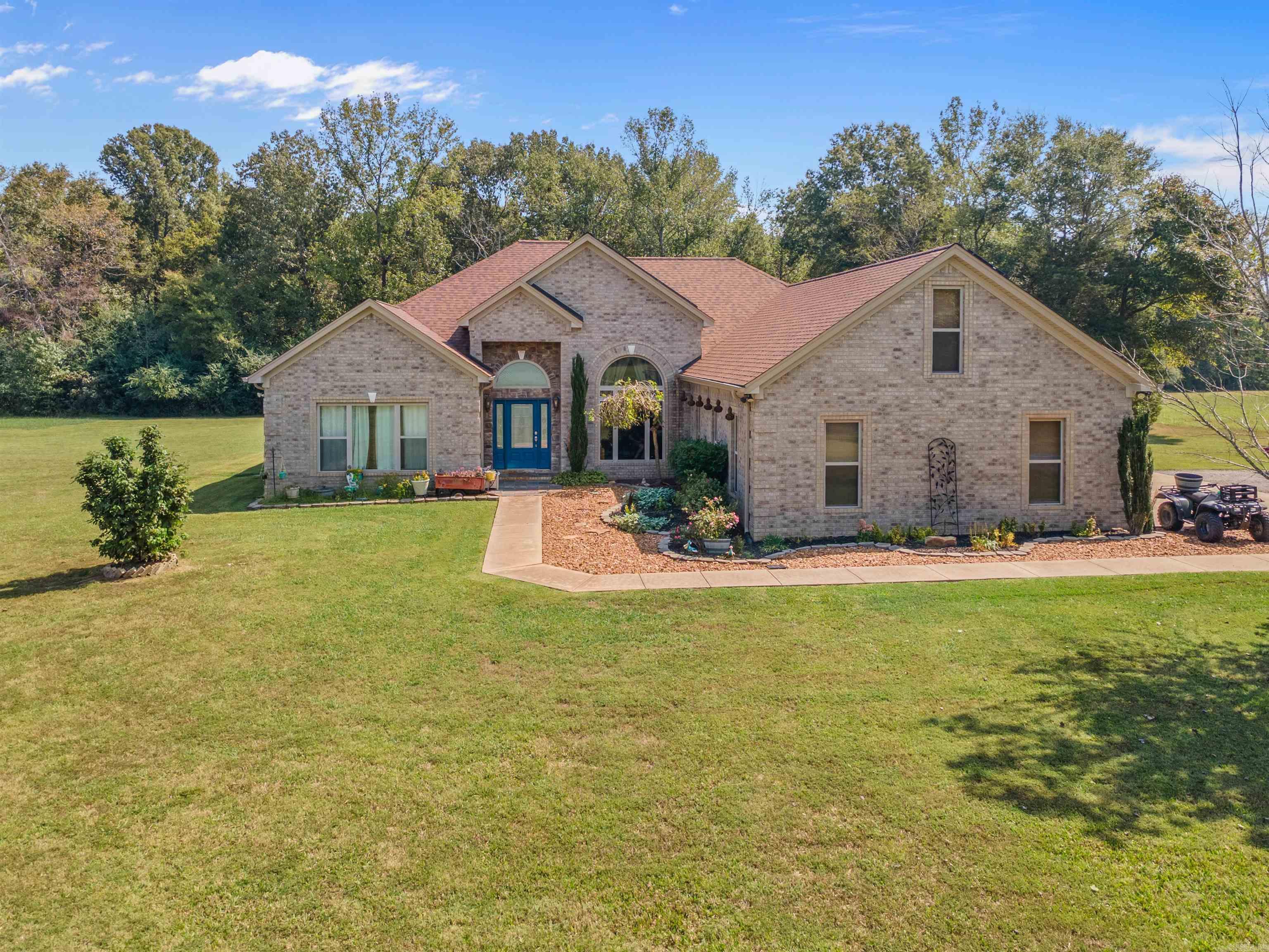 Tall ceilings with small bills all on 5 Acres! This one-level stunner has it all—tall ceilings, 3 spacious bedrooms plus an office, 2 full baths and 1 half bath, and a sought after 3-car garage. Built for both comfort and efficiency, the home comes with FULLY PAID-OFF solar panels so you can enjoy low utility bills from day one. They are under warranty until 2045! Home is all electric, all LED lighting inside and out, tankless water heater and that runs about $15/mo ALL YEAR LONG!!! The all-brick exterior adds timeless charm and easy maintenance, while the open, airy layout inside makes everyday living a breeze. Whether you’re hosting friends or enjoying quiet mornings, this home was designed with both style and function in mind. Outside, you’ll love the 5-acre setting—room to roam, garden, or just soak up the peace and privacy. Need more space? Additional land is available to fit your future plans, total land available is 28.8 acres across 3 parcels. Opportunities like this don’t come around often—schedule your showing today!