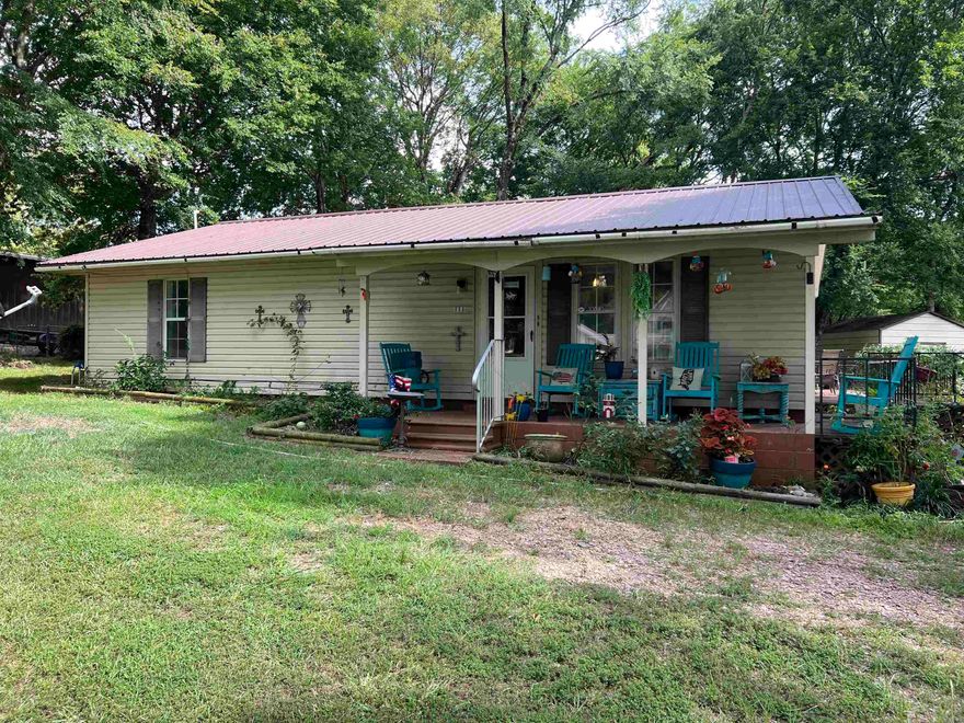 Welcome to this delightful 2-bedroom, 2-bathroom home nestled in the highly sought-after Horatio Homesite neighborhood. Spanning 1,176 sqft, this cozy home offers an inviting ambiance with plenty of space for comfortable living.  Step outside and enjoy your morning coffee on the charming front porch or unwind in the evenings on the serene patio. The .66-acre lot provides outdoor space for gardening, entertaining, or simply enjoying the peaceful surroundings.   For those in need of extra storage, this property has it all. You'll find additional outside storage perfect for your tools, hobbies, or seasonal items. The detached two-car garage offers convenient parking and even more storage options.   Don’t miss this opportunity to own a piece of tranquility in Horatio. Schedule your showing today and experience all this wonderful home has to offer!