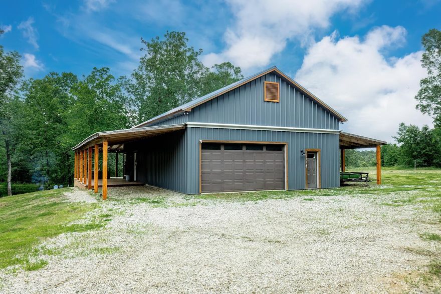 Discover the epitome of rustic charm and modern convenience with this stunning two-bedroom, one-and-a-half-bath barndominium, set on approximately 45 acres of scenic land. Built in 2019, this unique property features a large pond and a wrap-around deck, offering serene views and ample outdoor living space. Inside, beautifully stained concrete floors and an open-concept living, dining, and kitchen area create a warm and inviting atmosphere. The master suite, located on the main level, boasts a luxurious walk-in shower. Additionally, there's a versatile shop that can be converted into an additional master suite. The land includes some timber and offers endless possibilities for development or recreation. Situated close to the interstate and Arkadelphia, this property combines the tranquility of rural living with convenient access to amenities. Embrace the potential and make this extraordinary property your own.