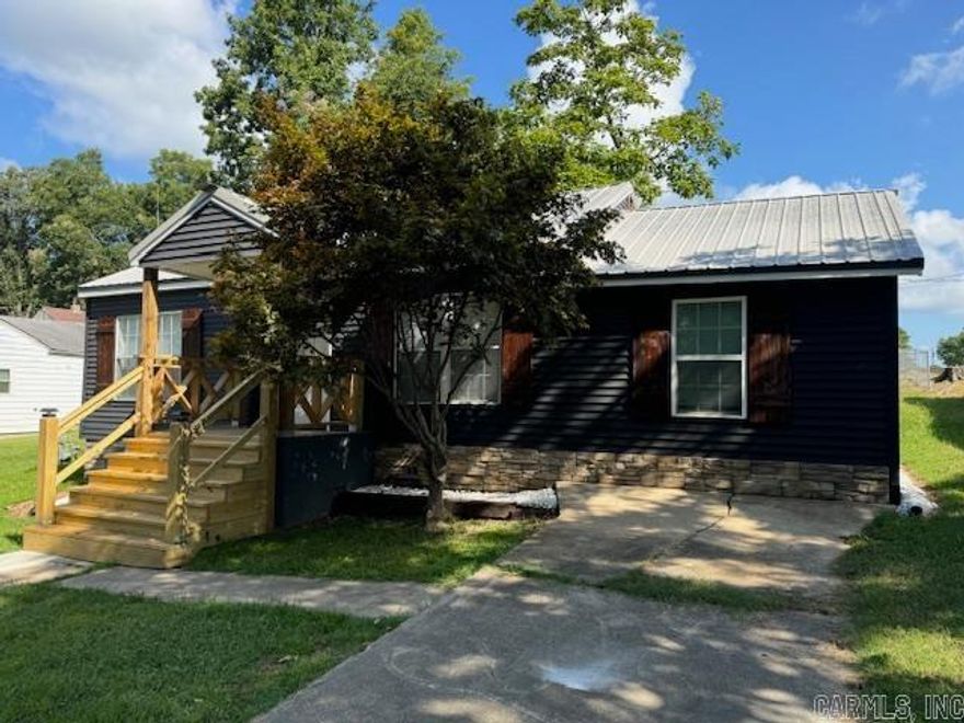 NICELY REMODELED 3BR HOME!  Adorable 3 bedroom, 1 bathroom home has been remodeled with the following ALL NEW upgrades: water heater, Goodman C/H/A, stainless appliances, tub, vanity, tile, cabinets, countertops, back splash, walk in closet, laundry room, bathroom and kitchen fixtures, lights, doors, shiplap style wall, waterproof LVP flooring, dining room table and chairs. Some new electrical and plumbing. Huge living room. Vinyl windows. 4 year old metal roof. Covered front porch, back deck and concrete patio. 1200 square foot. Sitting on .11 acre lot with city utilities!