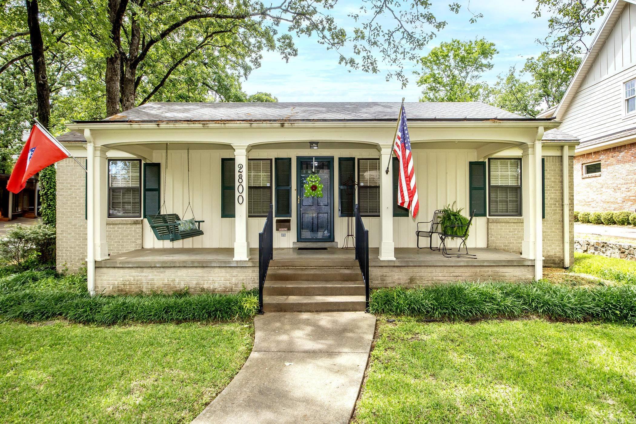 Adorable Heights cottage nestled on a spacious corner lot with a large front porch and side loading 2 car garage. This well maintained 3 or 4 bedroom, 2 bath house features a walk-in shower in the updated primary bathroom, updated kitchen, beautiful hardwood floors, a generator and a finished attic that can be used as a bedroom and playroom, office or craft room. Roof, hot water heater and dishwasher were all replaced in 2024. Agents see remarks.
