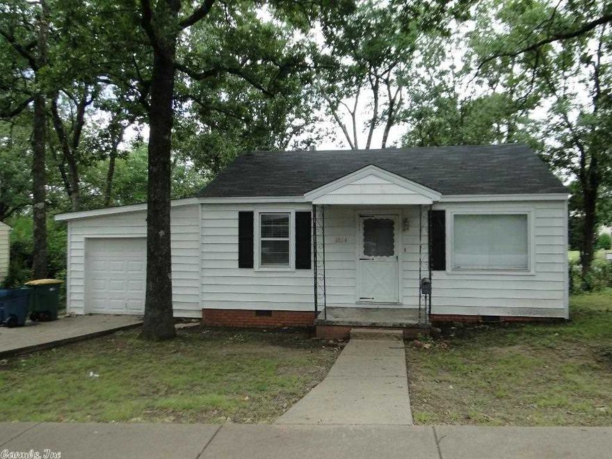 Very cute updated Bungalow just off Cantrell on the corner of Ohio and Georgia. Close to shopping and restaurants. Great for singles or students.  Refinished hardwood flooring in living room and both bedrooms. New tile in the kitchen. Owner will be installing a new gas range.  Central heat and air. Laundry room. Large shady backyard with storage building. Nice deck. New blinds.  1 car garage with automatic door opener. Seller is a licensed real estate agent in Arkansas.