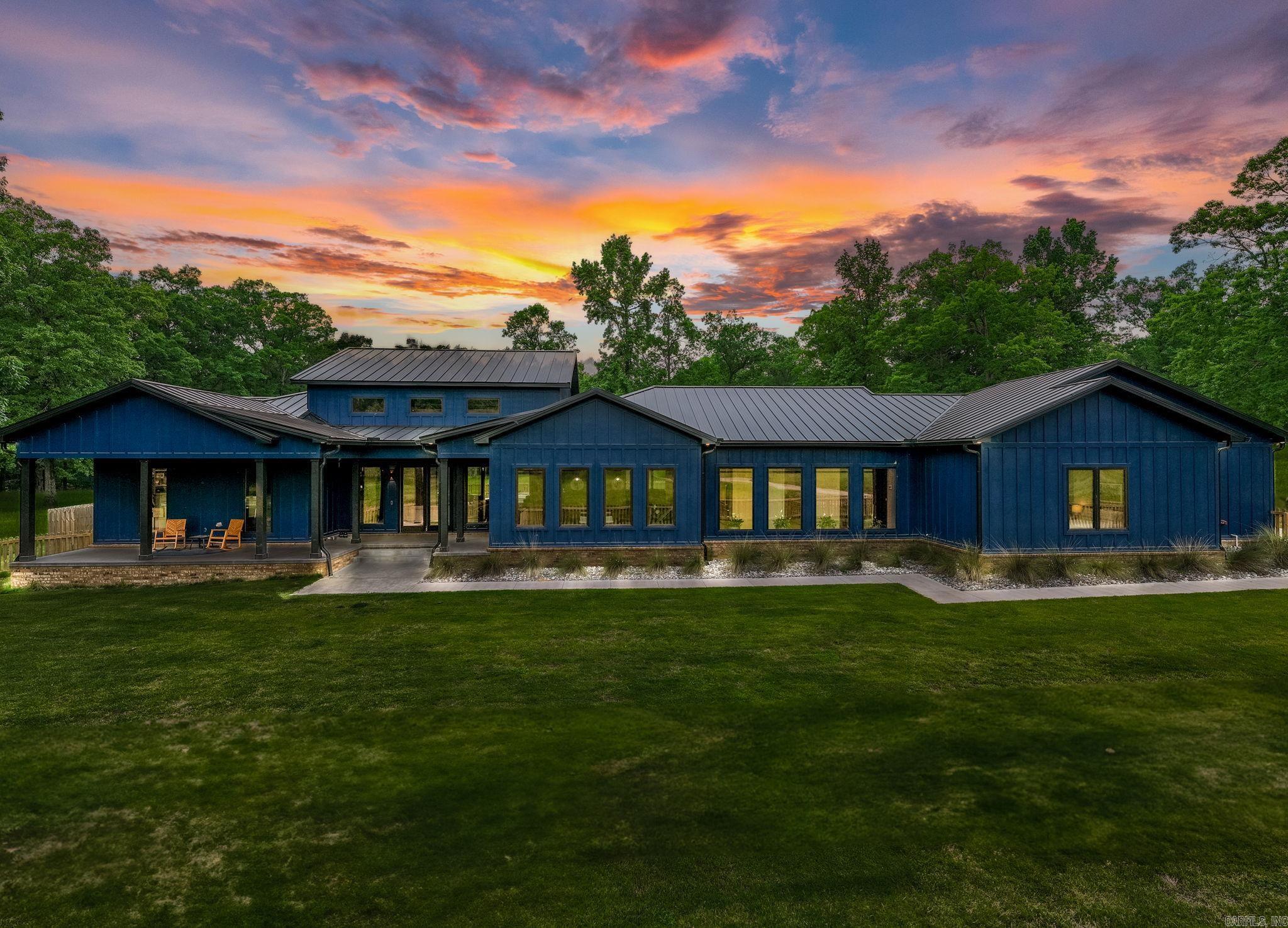 Spectacular Newer construction on gorgeous 20+ acres! The ultimate setting for family living and entertaining. High quality custom finishes and exquisite amenities set the tone for the best of country living. Fantastic floor plan with soaring ceilings and spacious proportions. Gorgeous beamed family room with fireplace, exceptional chef's kitchen with top of the line appliances, island and large walk in pantry. Resort styed primary suite with luxurious bath. Large guest suites. Fabulous media room/den. Generator. Step outside and enjoy the privacy along with fantastic covered terrace w/outdoor kitchen, stunning pool & sun terrace. Barn with two tack rooms & 6 stalls, and scenic pond - all set on gorgeous land. Your own oasis and personal retreat just minutes from Chenal! Solar powered security gate. Do not miss this exceptional home!
