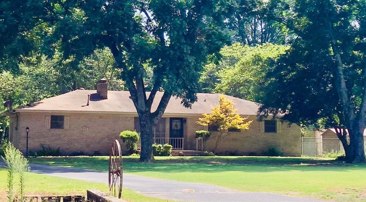 Discover this unique and versatile property nestled in a peaceful setting in North Little Rock. The main home offers 2 spacious bedrooms and 2 full bathrooms. The expansive living room provides ample space for gatherings. A standout feature is the two story shop with a studio apartment.