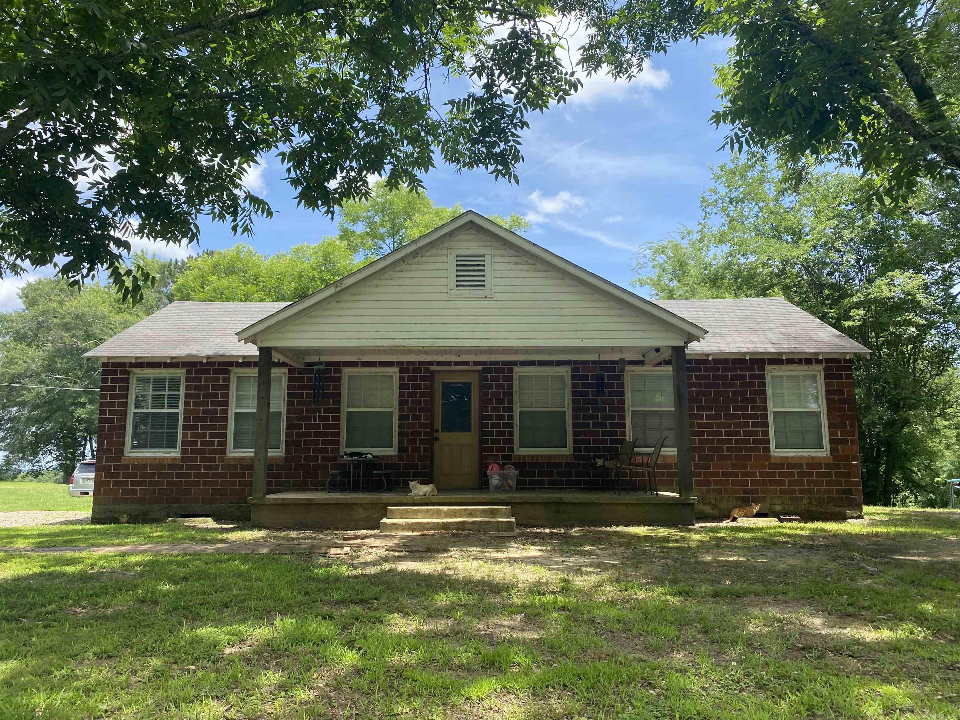 House on the hill? Check! Move in ready and completely updated on the interior? Check! Huge shop and a little land to stretch out on? Check! This is one of those properties that only comes available once in a while, and here is your chance to make it yours. The home sits on 4.75+/- rolling acres and includes a small storage building and a high quality 60x40 metal shop. On the inside, the sellers have completely renovated this home, replacing flooring, paint, countertops, cabinetry; they even moved some walls to make the home more functional than it already was. T