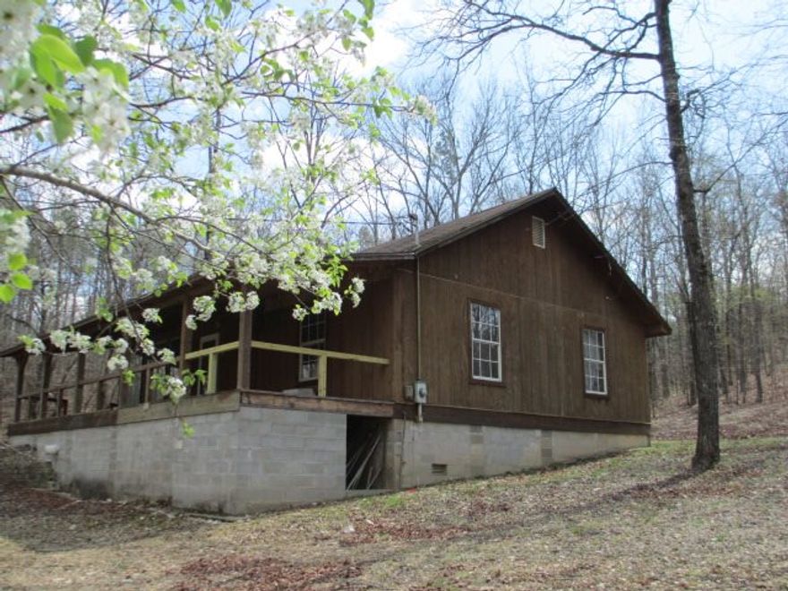 TOTAL SECLUSION on 11.30 acres. Watch the wild life from your expansive front porch. Home is a perfect escape. 2bd 1ba, wood stove will keep you warm in the winter and window air will keep you cool. Home boasts a safe room in case of a storm plus a fantastic 16x24 work shop that's heated and cooled. DON'T TRY TO ACCESS PROPERTY BY CAR, NEED TRUCK, RV OR 4 WHEEL DR.