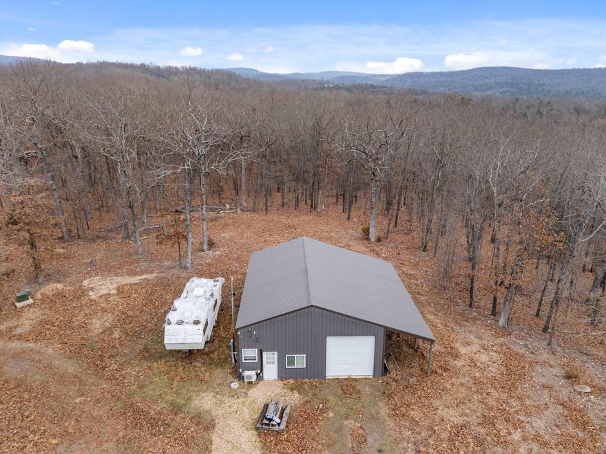 If you have been waiting for a private retreat with a lake view, LOOK NO FURTHER! 40 ACRES M/L bordering corp land with a perfect spot to build your dream home with a lake view. Gate at entrance protects your privacy and security system to enhance it. Plenty of wildlife and a hunter’s dream!!!! Includes already built 30 X 4O shop with a lean to attached and a 15 X 15 living quarters with 1/2 bath while you build your home or just to live in. Septic/Well/Electric/NEXT internet already in place. RV hookups included to bring your camper if needed. Close to boat launch at Oakland Marina and Park. What more could you want? Don’t wait or you may miss this gem. Camper on property in pics does not convey.