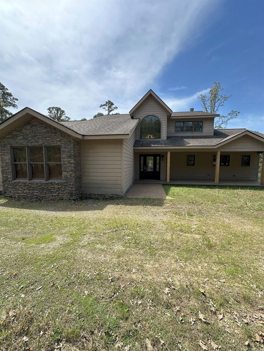 Come see this gorgeous custom built 4 bed 2.5 bath home on the shores of Greers Ferry Lake. This home features high-end Anderson windows and doors, that prove to be energy efficient. Durable and stylish LVP and tile flooring throughout making it perfect for lake life. Built in's and large pantry for extra storage. Stunning views of the surrounding woods and water. The oversized garage adds space for vehicles, lake toys, or a workshop. Enjoy entertaining on the very large back patio or watch the sunsets from your balcony. Easy walk to the water and new path permit in place! Enjoy the peace and privacy this lake home brings. Tannenbaum resort, offers a popular golf course, trails and hiking, and water play. 8 miles to the nearest boat launch on ramp lane. Schedule a showing today! (Agents See Remarks)