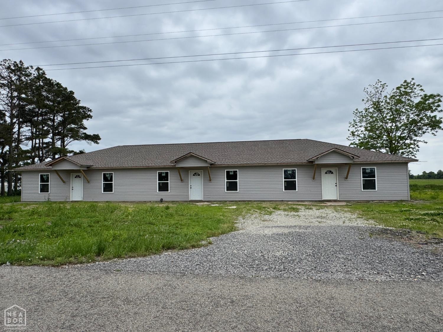 This property contains 3 units. There are two 2 bed/2bath units and one 2 bed/ 1 bath unit. The 2 bed 2 bath units have been wired and have sheetrock up. The 2 bed 1 bath unit is framed only. Please call for additional details