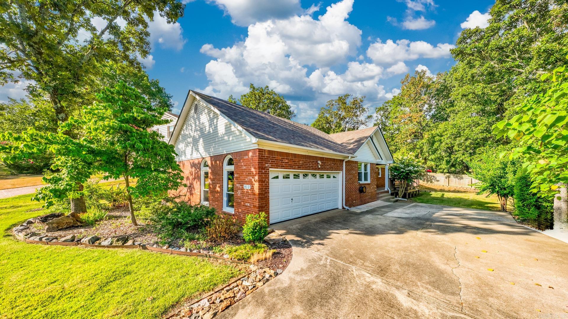 This is a great 3 Bed 2 Bath super conveniently located in West Little Rockās Walnut Valley with a newer roof, HVAC, and all new windows & doors. From the covered front porch with the entertainers deck, youāre welcome through the windowed double doors, to find your .75ā premium hardwoods and updated lighting throughout. Enter at the large wood beamed ceiling living with the stacked stone fireplace, spacious dining area, and access to your back deck, overlooking your park like backyard with the gate to the greenery. Your open kitchen highlights the windowed breakfast room, faux granite counters with the built-in stove, a nice gray tile splash, and antique cabinetry. The primary suite has the dual closets and walk-in shower. Donāt miss the large laundry or the oversized workshop space inside the two car side entry entry garage.