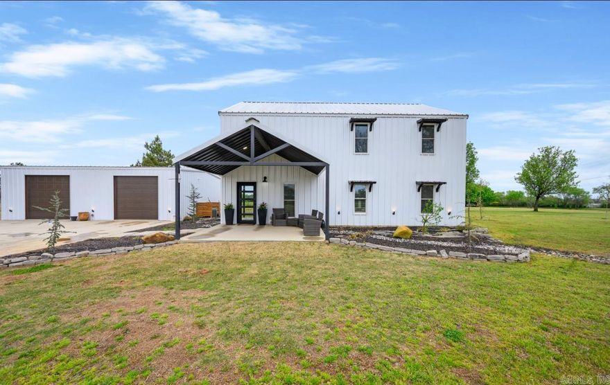 Custom built in 2023, this contemporary home offers all the bells and whistles: Two story home offers a spacious living space, separate shop building w/full bath, separate hot water and CH/CA, covered patio with gas fireplace, hot tub and outdoor shower, fire-pit, pickleball/basketball court and putting greens.  Home offers open concept: living room with electric fireplace and vaulted ceiling, kitchen offers large island/bar, gas stove, dishwasher, built in microwave and refrigerator.  Master suite downstairs with master bath, two additional bedrooms and two full bathrooms upstairs. Guest half bath, large laundry room, on demand hot water, EV charger, and commercial LED string lighting.  A must see! Contact our office for more details.