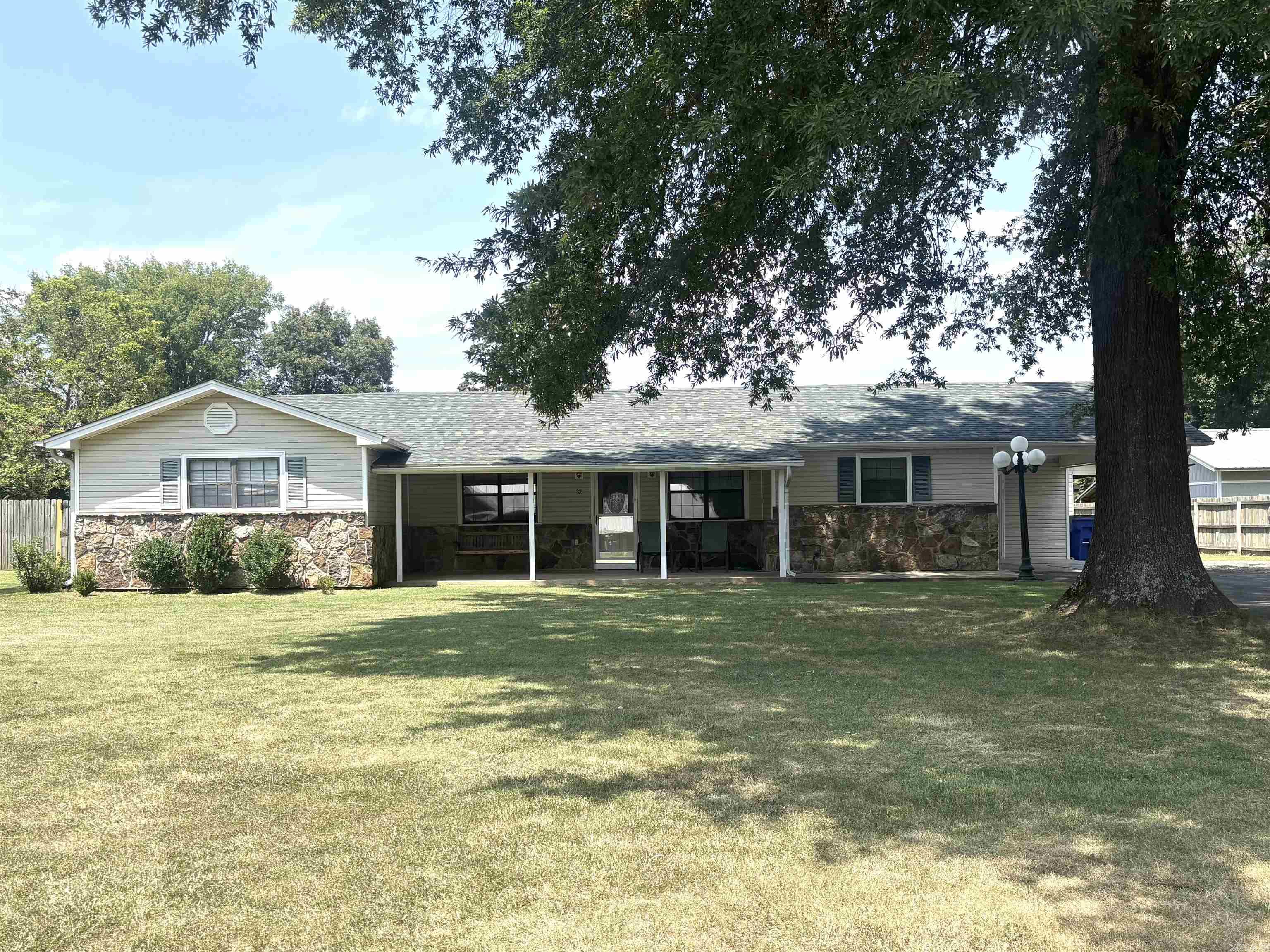 Welcome to this wonderful 3 bed/2 bath home that sits on approx. .86 acres. There are so many storage buildings (some have electricity) outside, a nice covered deck, carport and a nice front porch. Kitchen features great cabinet storage, counter space and a nice eat in area. The French doors in the living room look out to the beautiful backyard. Many updates in this home-2024-roof, 2021-bathroom remodel with new fixtures, vinyl siding added to workshop,2017-HVAC, newer carpet/wood flooring in living room and hallway. Call today to make your appt. to see this wonderful home that is just minutes away from shopping and restaurants. Agents see attached documents for more info.