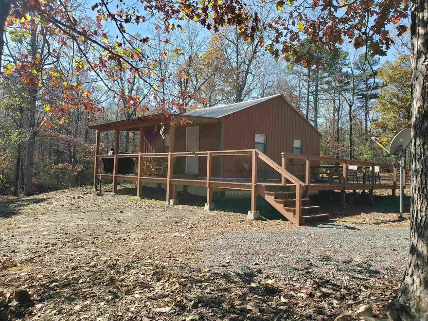 Escape to the woods & discover this beautifully remodeled cabin tucked away on 14.64 acres of serene, wooded land. Whether you’re seeking a peaceful getaway, an outdoor adventure, or an investment property, this fully furnished, turn-key cabin is ready for you to enjoy or rent out as an Airbnb or VRBO. The cabin has metal siding, metal roof, vinyl plank flooring, new appliances including washer/dryer. Explore the 14.64 acres, ideal for hiking, hunting, or simply unwinding in nature. A separate section of land on the property has its own electric meter—perfect for adding another cabin or selling off if you prefer. Located just 40 min from the stunning Greers Ferry Lake, this cabin offers easy access to water activities, boating, and fishing. If you love hunting, you're just 45 minutes away from public land with abundant hunting opportunities & just 1.5 hours from Branson, MO. With close proximity to recreational spots and outdoor adventures, this property provides the perfect balance of seclusion and convenience. Use it yourself, and when you’re not there, generate income by renting it out to visitors looking for a rustic getaway in the woods.